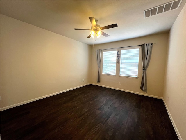 13842 Evansdale Ln, Houston, TX 77083 - empty room featuring dark wood-style flooring, a ceiling fan, and baseboards