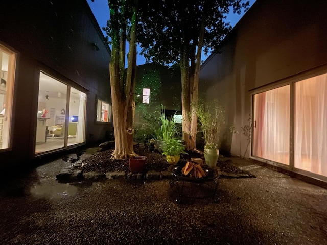 11414 Cedar Creek Dr, Houston, TX 77077 - yard at twilight featuring a fire pit