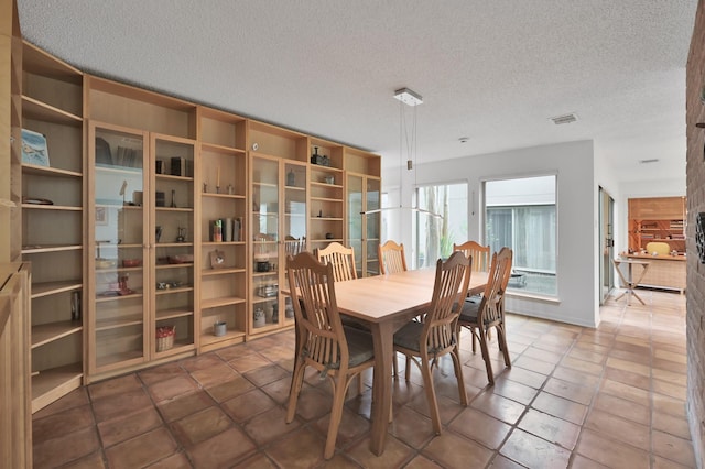 11414 Cedar Creek Dr, Houston, TX 77077 - dining area featuring a textured ceiling