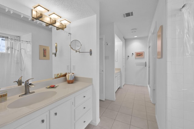 11414 Cedar Creek Dr, Houston, TX 77077 - full bathroom featuring tile patterned flooring, vanity, a shower with shower curtain, and baseboards
