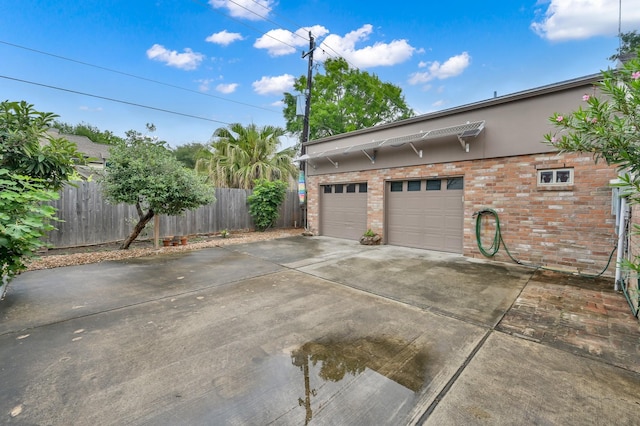 11414 Cedar Creek Dr, Houston, TX 77077 - garage featuring driveway and fence