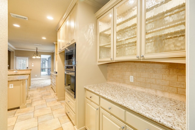 106 Arrowhead Dr, Lake Jackson, TX 77566 - bar area with appliances with stainless steel finishes, crown molding, decorative backsplash, a chandelier, and recessed lighting