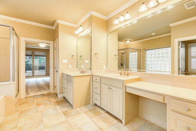 106 Arrowhead Dr, Lake Jackson, TX 77566 - bathroom featuring ornamental molding, a shower, and two vanities