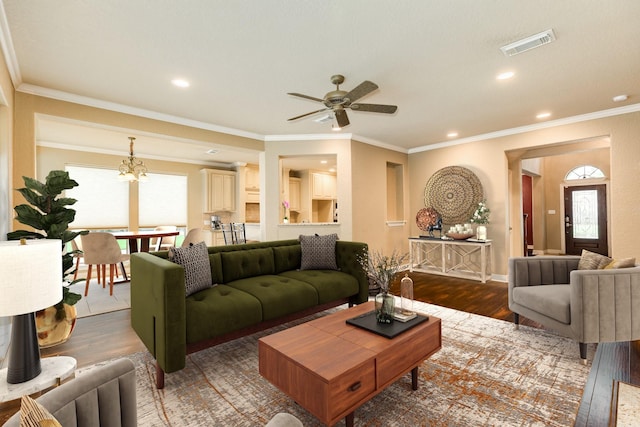 106 Arrowhead Dr, Lake Jackson, TX 77566 - living room with wood finished floors, a ceiling fan, recessed lighting, ornamental molding, and a chandelier