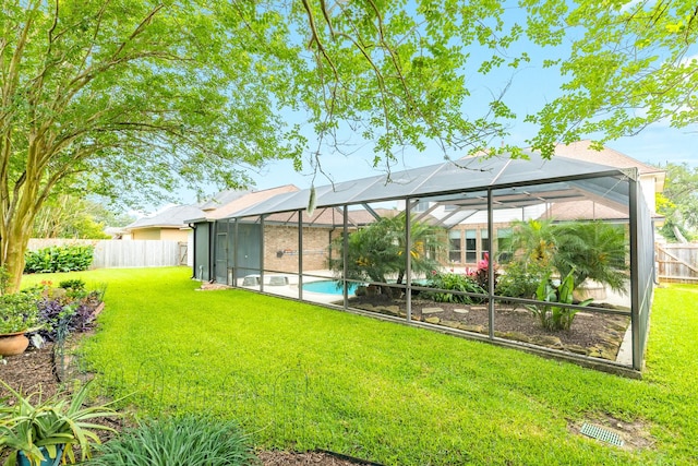 106 Arrowhead Dr, Lake Jackson, TX 77566 - back of property featuring an outdoor pool and glass enclosure