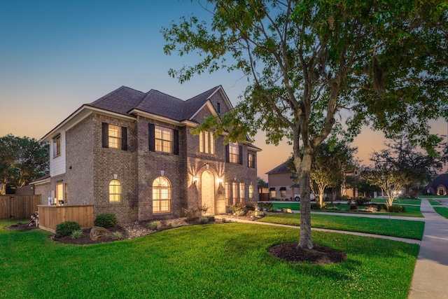 106 Arrowhead Dr, Lake Jackson, TX 77566 - georgian-style home featuring brick siding