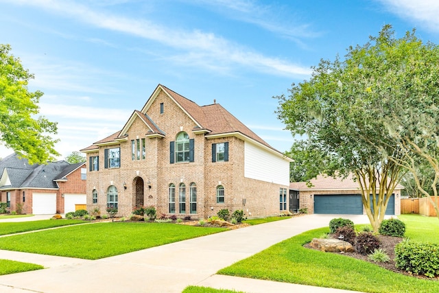 106 Arrowhead Dr, Lake Jackson, TX 77566 - colonial home featuring brick siding, driveway, and a garage