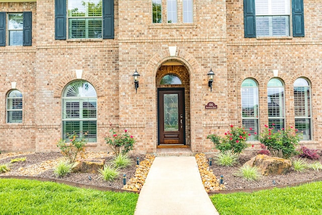 106 Arrowhead Dr, Lake Jackson, TX 77566 - doorway to property featuring brick siding