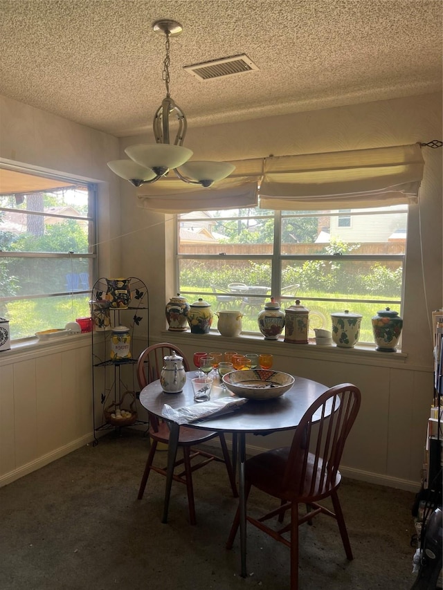5727 Pebble Springs Dr, Houston, TX 77066 - dining room with a textured ceiling and healthy amount of natural light