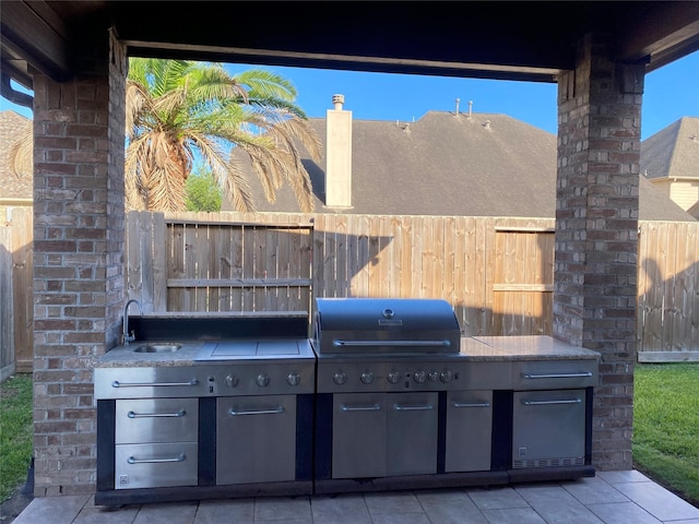 24211 Bella Florence Dr, Richmond, TX 77406 - view of patio / terrace featuring exterior kitchen and a sink