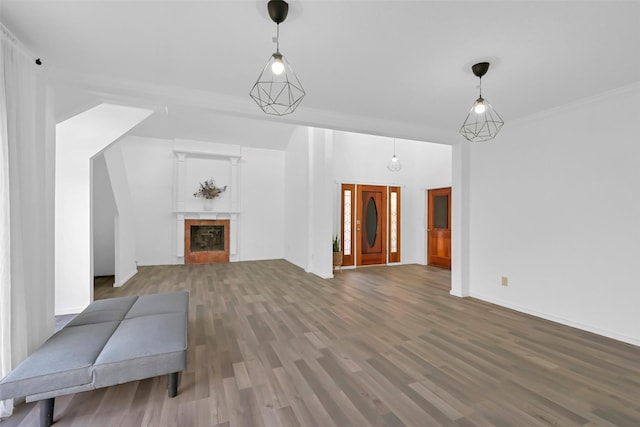 10731 Sageberry Dr, Houston, TX 77089 - unfurnished living room featuring wood finished floors, a tiled fireplace, and baseboards