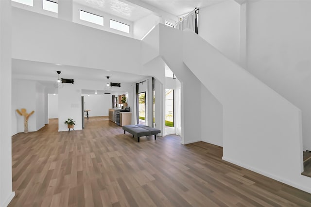 10731 Sageberry Dr, Houston, TX 77089 - bonus room featuring a towering ceiling, plenty of natural light, and wood finished floors