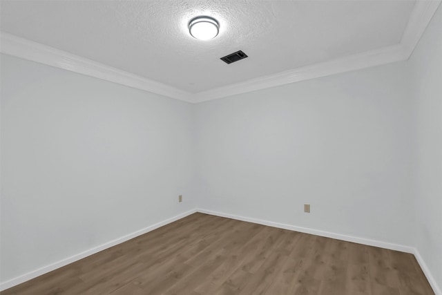 10731 Sageberry Dr, Houston, TX 77089 - empty room featuring crown molding, dark wood-type flooring, baseboards, and a textured ceiling