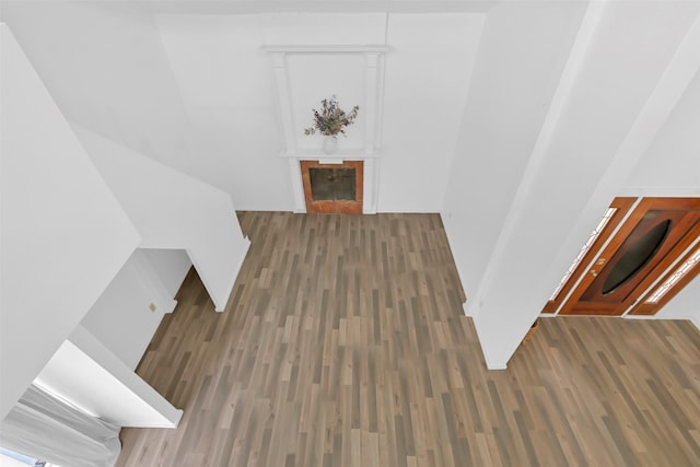 10731 Sageberry Dr, Houston, TX 77089 - stairway with a tiled fireplace and wood finished floors