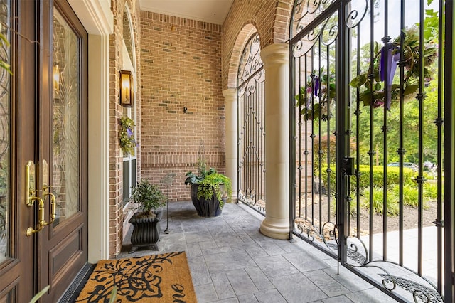 23303 Holly Creek Trl, Tomball, TX 77377 - doorway to property featuring french doors, brick siding, and a gate