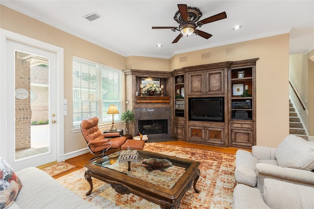 23303 Holly Creek Trl, Tomball, TX 77377 - living area featuring a premium fireplace, ceiling fan, light wood-style floors, stairway, and recessed lighting