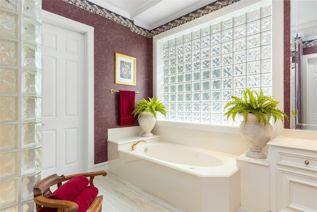 23303 Holly Creek Trl, Tomball, TX 77377 - full bath with ornamental molding, a garden tub, wallpapered walls, and baseboards