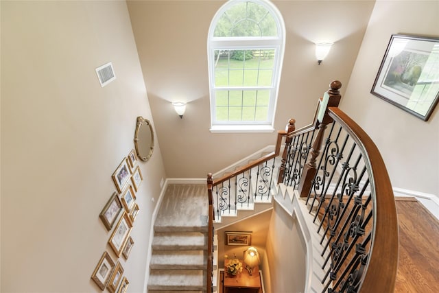 23303 Holly Creek Trl, Tomball, TX 77377 - stairs featuring a high ceiling and baseboards
