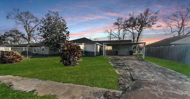 view of front facade with driveway, an attached garage, and a carport