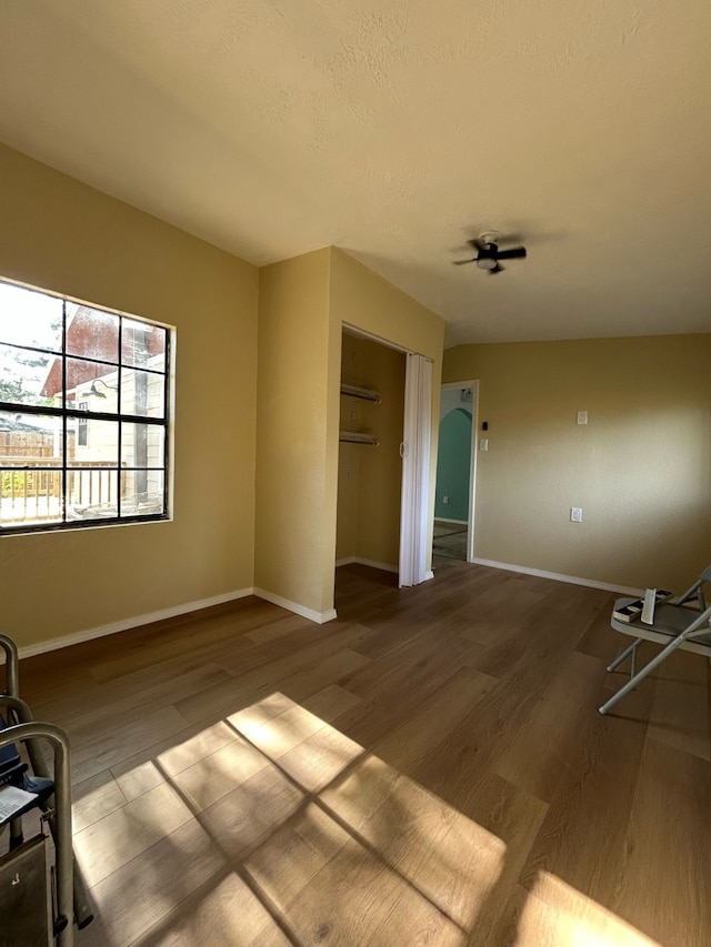 9974 Elder St, Willis, TX 77318 - empty room with wood finished floors and baseboards