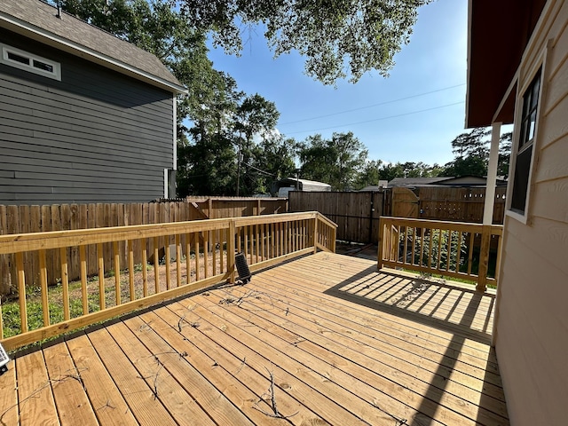 9974 Elder St, Willis, TX 77318 - wooden deck with a fenced backyard