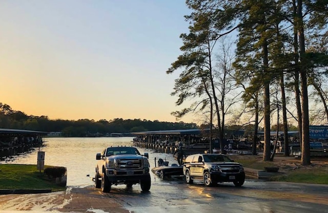 9974 Elder St, Willis, TX 77318 - view of parking featuring a water view