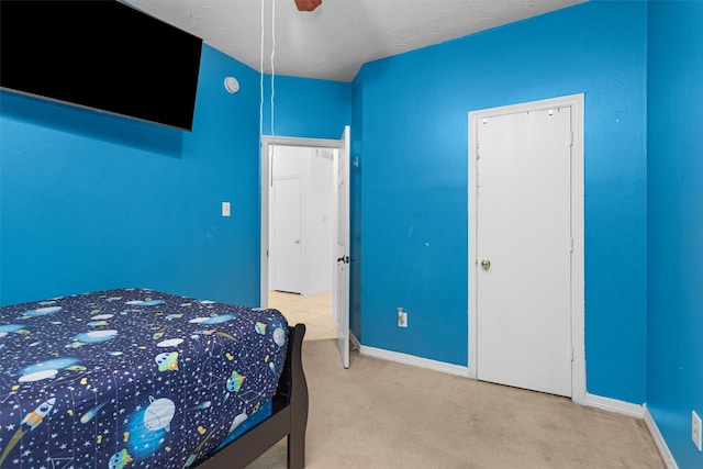bedroom featuring carpet flooring, baseboards, and ceiling fan