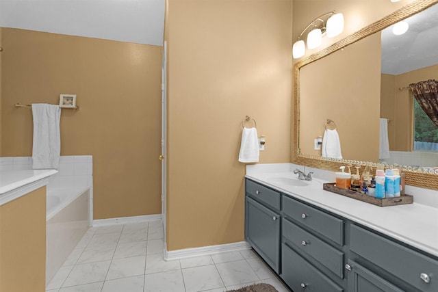 bathroom featuring vanity, a bath, and baseboards