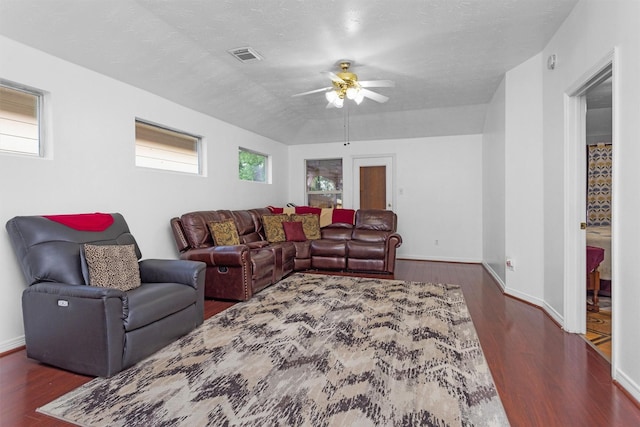 living room featuring ceiling fan, wood finished floors, and baseboards