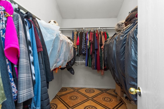 spacious closet featuring tile patterned flooring