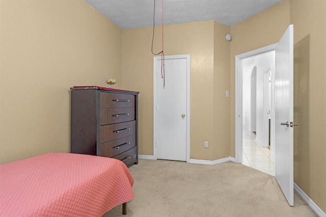 bedroom with carpet floors and baseboards