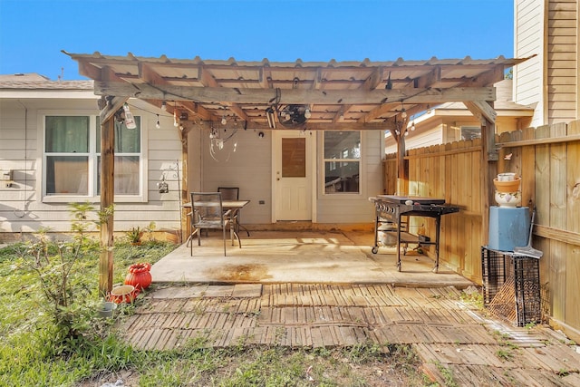 view of patio / terrace featuring a pergola and fence