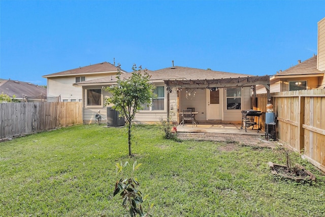 rear view of property with central air condition unit and a patio