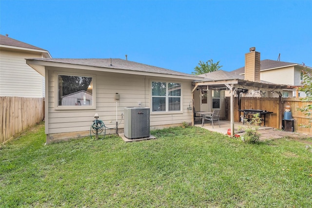 rear view of property featuring cooling unit, a pergola, and a patio area