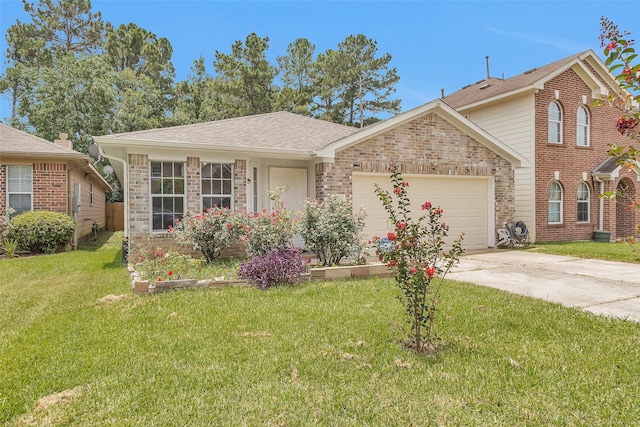 5019 Deerpath Dr, Conroe, TX 77303 - view of front facade with concrete driveway, a garage, a front lawn, and brick siding