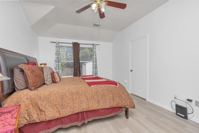 5019 Deerpath Dr, Conroe, TX 77303 - bedroom featuring wood finished floors, vaulted ceiling, and a ceiling fan