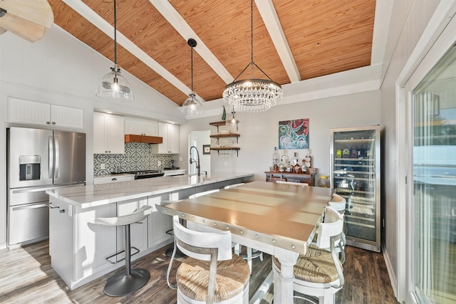 4321 Jolly Roger Rd, Galveston, TX 77554 - kitchen featuring stainless steel fridge with ice dispenser, wine cooler, wood ceiling, a chandelier, and light countertops