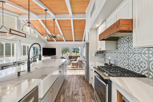 4321 Jolly Roger Rd, Galveston, TX 77554 - kitchen with stainless steel appliances, wooden ceiling, a sink, a chandelier, and open floor plan