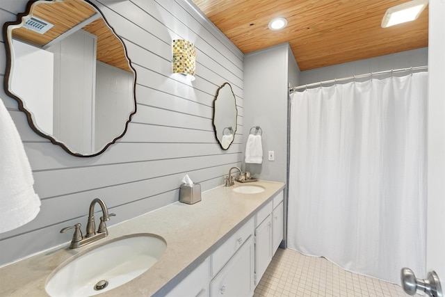 4321 Jolly Roger Rd, Galveston, TX 77554 - full bathroom with wooden ceiling, tile patterned floors, double vanity, recessed lighting, and wood walls