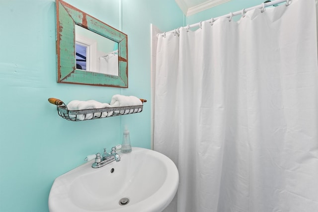4321 Jolly Roger Rd, Galveston, TX 77554 - bathroom featuring a sink, a shower with curtain, and ornamental molding