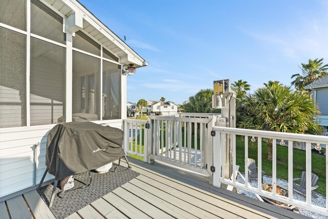4321 Jolly Roger Rd, Galveston, TX 77554 - deck featuring a sunroom