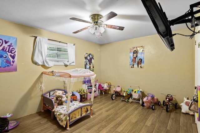 309 Kings Hl, Palacios, TX 77465 - bedroom with wood finished floors and ceiling fan