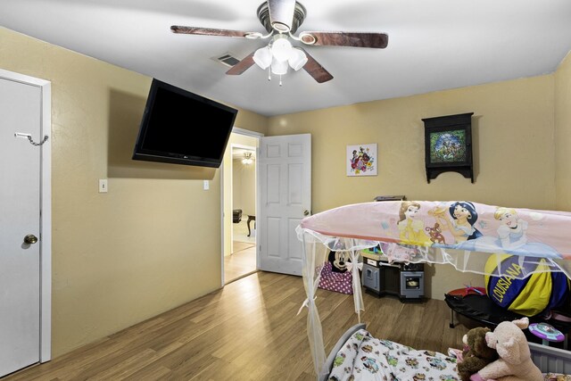 309 Kings Hl, Palacios, TX 77465 - bedroom with wood finished floors and ceiling fan
