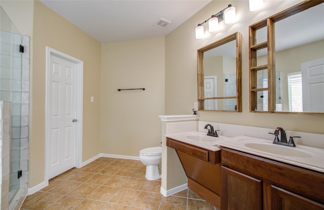17607 Memorial Falls Dr, Tomball, TX 77375 - bathroom with a stall shower, tile patterned floors, double vanity, toilet, and baseboards