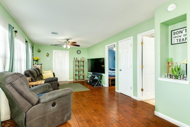 107 Crows Nest Rd, Freeport, TX 77541 - living area with wood-type flooring, ceiling fan, and baseboards