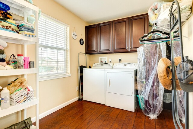 107 Crows Nest Rd, Freeport, TX 77541 - clothes washing area featuring cabinet space, washing machine and clothes dryer, dark wood-type flooring, and plenty of natural light
