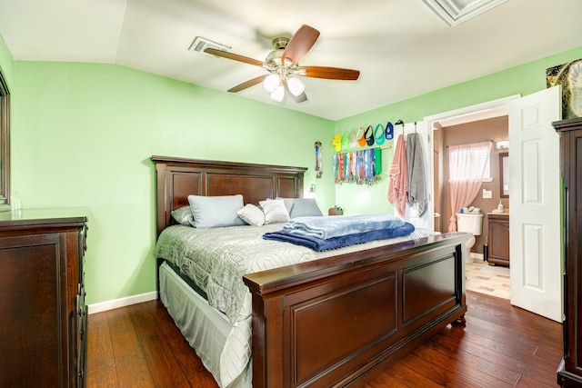 107 Crows Nest Rd, Freeport, TX 77541 - bedroom featuring dark wood finished floors, baseboards, ceiling fan, vaulted ceiling, and ensuite bathroom