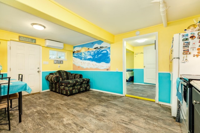 107 Crows Nest Rd, Freeport, TX 77541 - living area with a wall mounted AC, wood finished floors, and beam ceiling