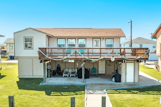 107 Crows Nest Rd, Freeport, TX 77541 - back of house featuring a deck, a patio, and a lawn