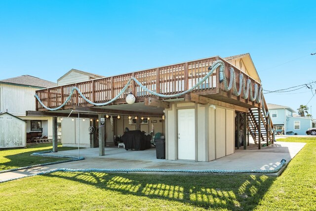 107 Crows Nest Rd, Freeport, TX 77541 - rear view of house with stairway, a yard, a deck, and a patio area